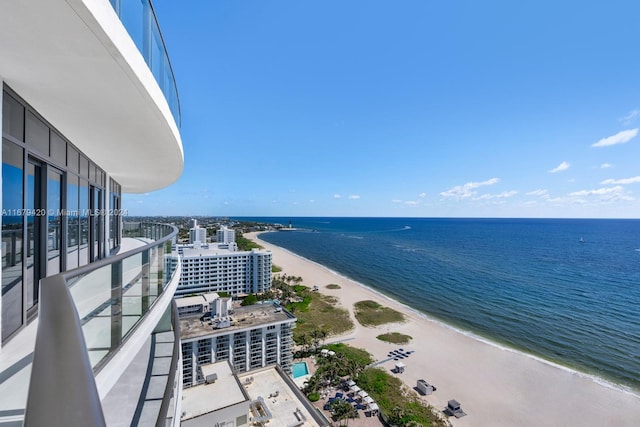 exterior space featuring a water view and a view of the beach