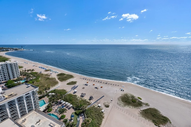 bird's eye view featuring a water view and a view of the beach