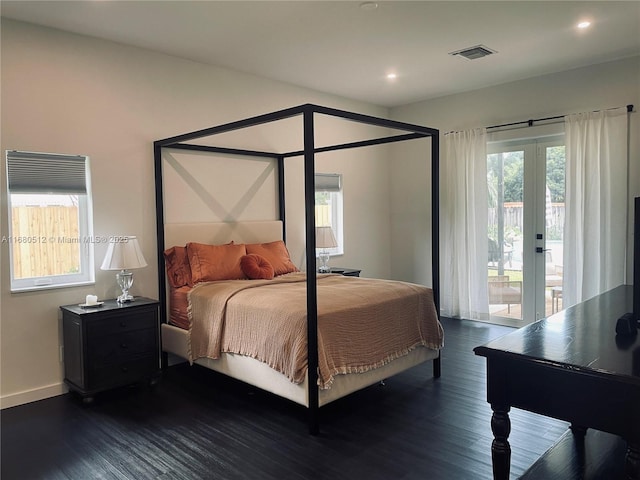 bedroom featuring french doors, dark hardwood / wood-style flooring, and access to outside