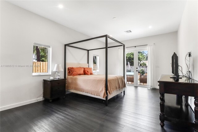 bedroom featuring access to exterior and dark wood-type flooring