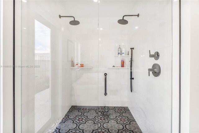 bathroom with a shower with shower door