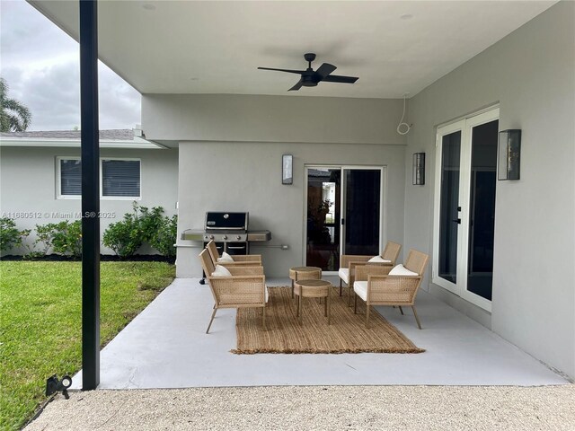 view of patio / terrace featuring ceiling fan and grilling area