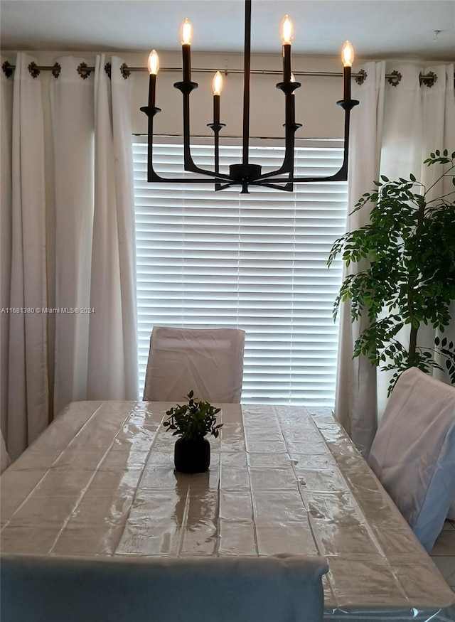 unfurnished dining area with a chandelier