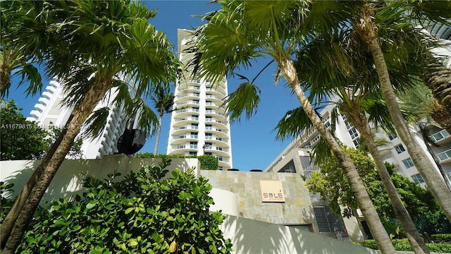 view of building exterior featuring fence