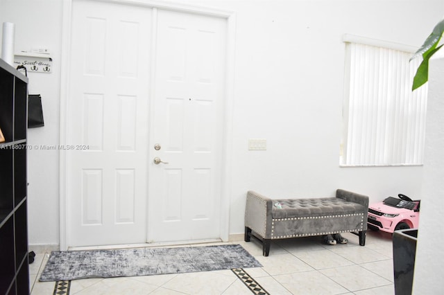 entryway featuring light tile patterned floors