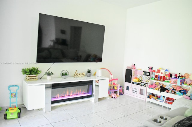 rec room featuring light tile patterned flooring