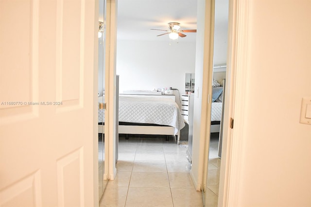 corridor featuring light tile patterned floors