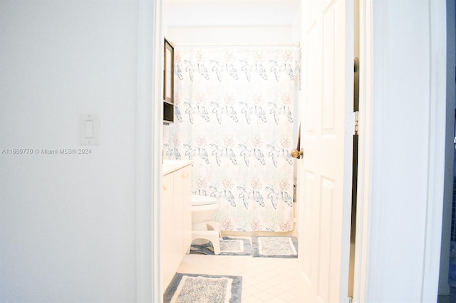 hallway featuring light tile patterned flooring