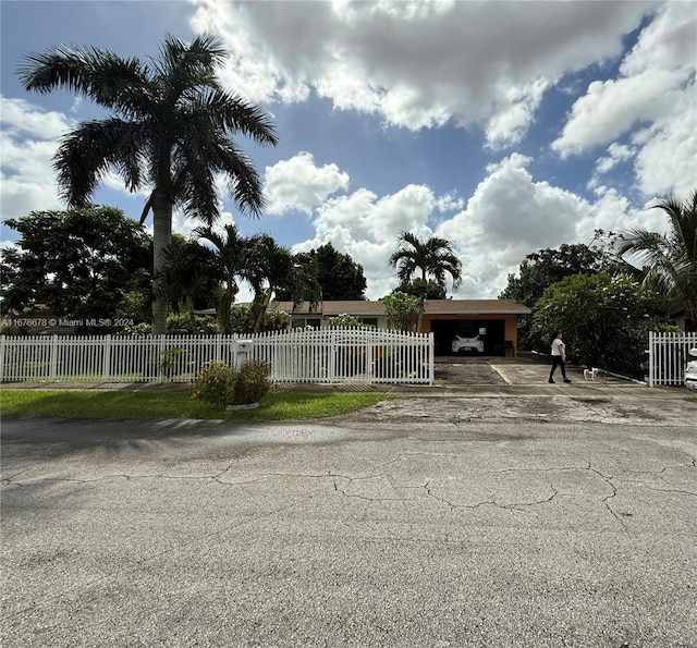 view of front of property with a carport