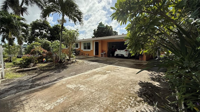 single story home featuring a garage