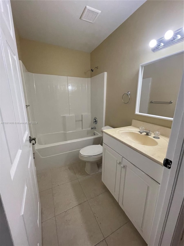 full bathroom featuring toilet, vanity,  shower combination, and tile patterned floors