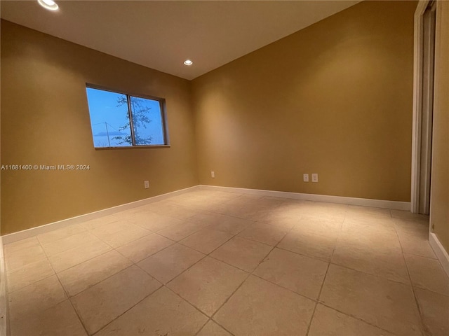 empty room with light tile patterned flooring