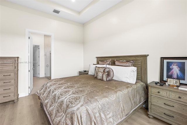 bedroom with light hardwood / wood-style floors