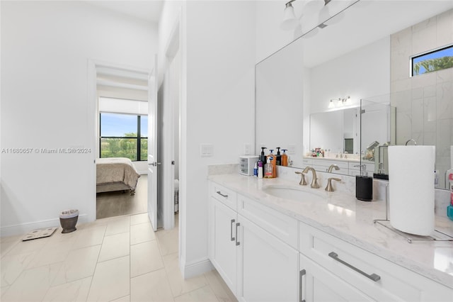 bathroom with a shower and vanity