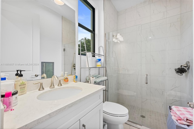 bathroom with walk in shower, vanity, and toilet