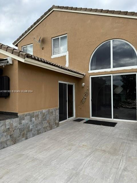 rear view of house with a patio