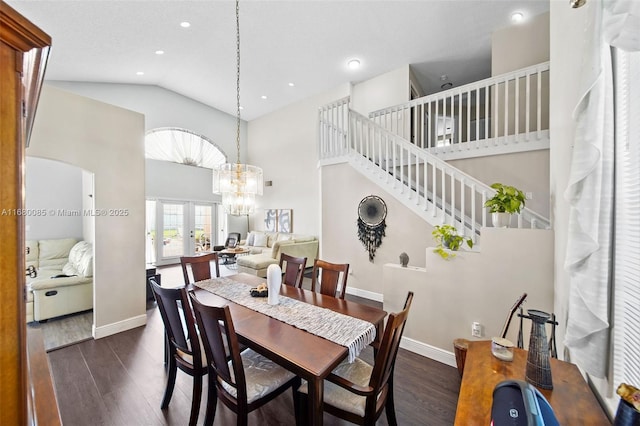 dining area featuring baseboards, high vaulted ceiling, dark wood finished floors, and french doors