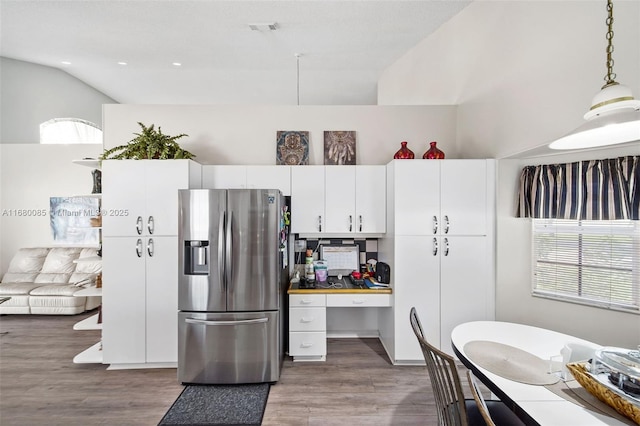 kitchen with pendant lighting, visible vents, dark wood-type flooring, white cabinetry, and stainless steel fridge with ice dispenser