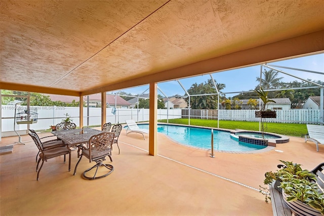 view of swimming pool with a patio area, a fenced backyard, a pool with connected hot tub, and a lanai