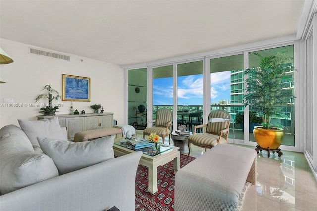 living room featuring expansive windows and visible vents