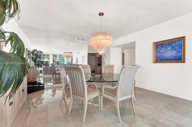 dining space with a chandelier, visible vents, and light tile patterned floors