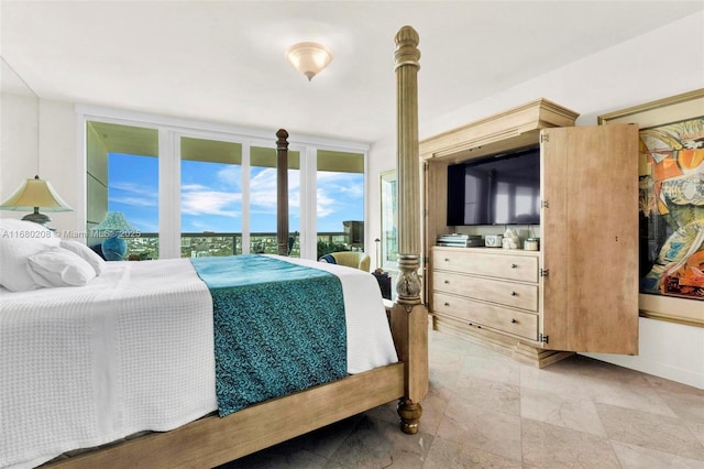 bedroom featuring access to exterior and expansive windows