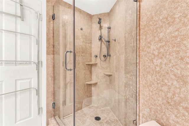 bathroom with a stall shower