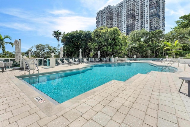 community pool featuring a patio area