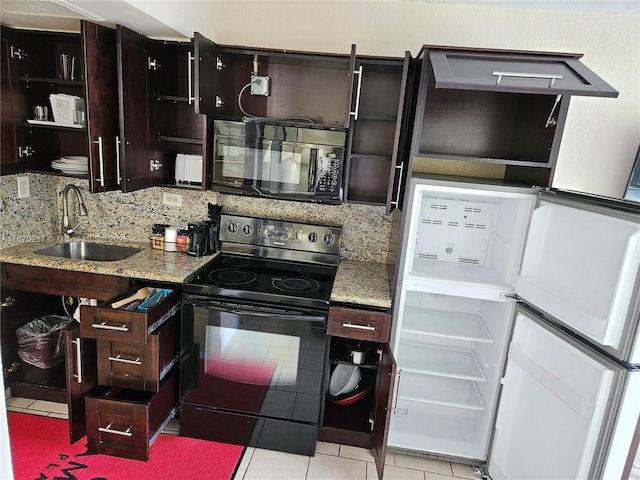 kitchen with open shelves, backsplash, light tile patterned flooring, a sink, and black appliances