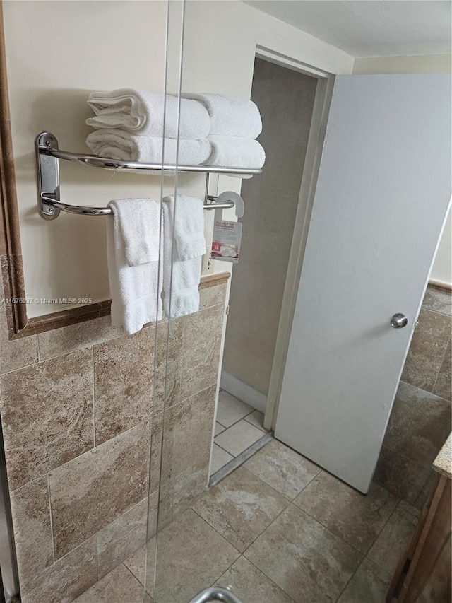 bathroom with tile patterned floors