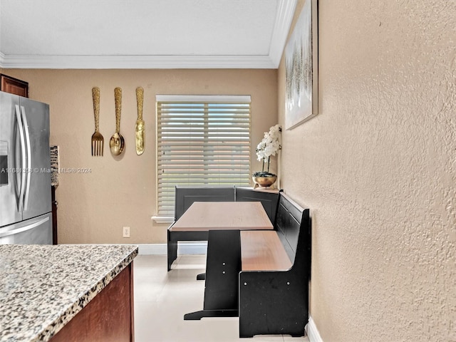 dining room featuring crown molding