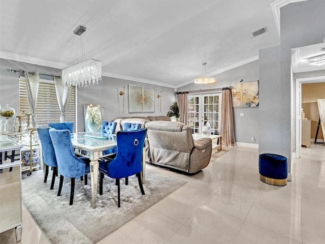 dining area with crown molding, a notable chandelier, lofted ceiling, and light tile patterned floors