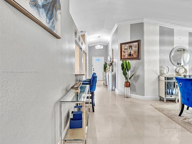 corridor with crown molding and vaulted ceiling