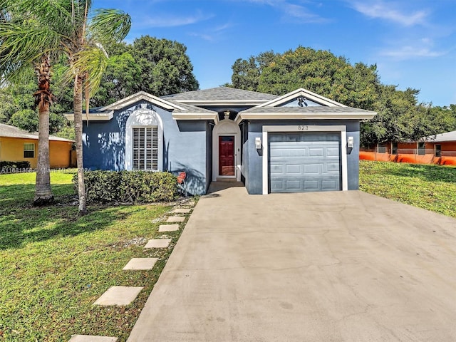 ranch-style house with a front lawn and a garage