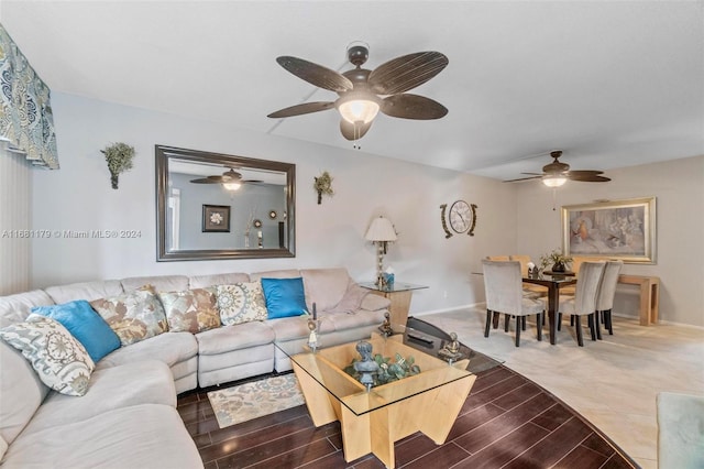 living room featuring ceiling fan and hardwood / wood-style flooring