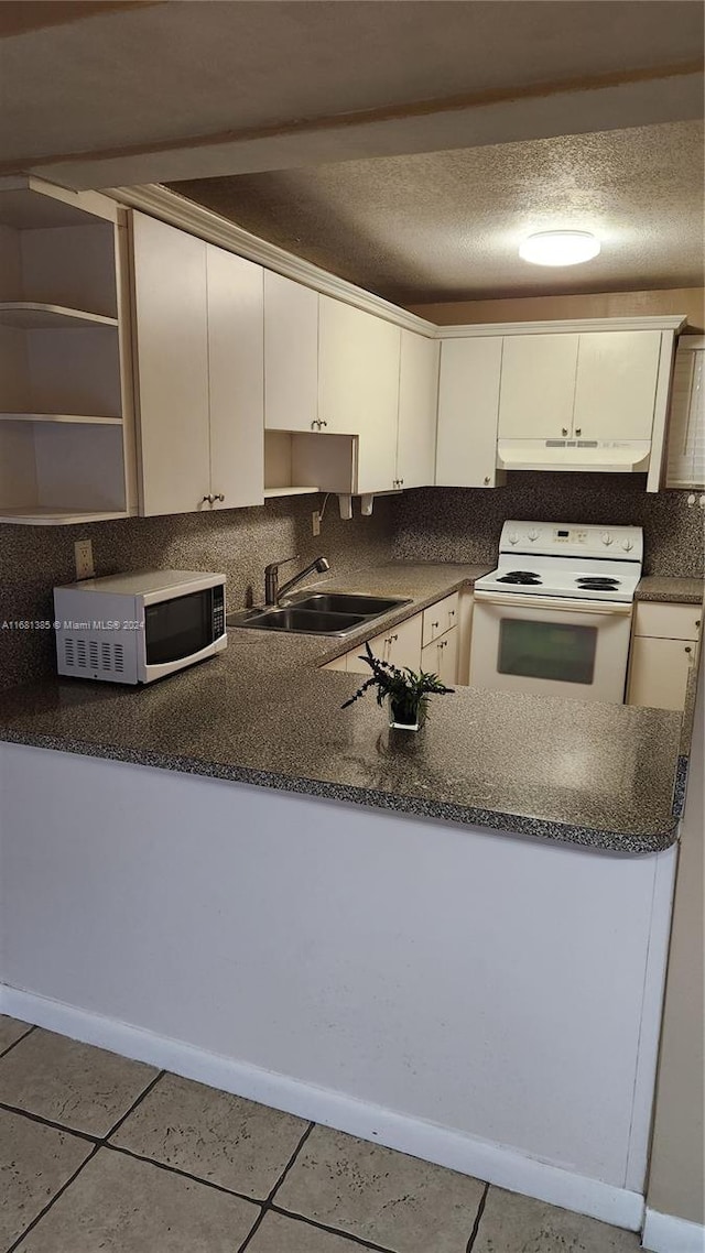 kitchen featuring sink, white cabinetry, white appliances, and light tile patterned floors