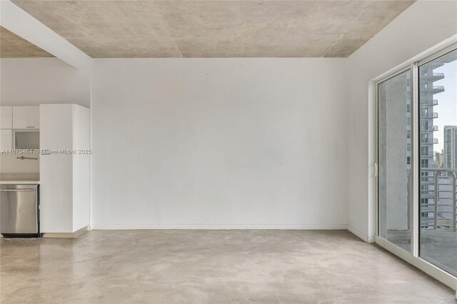 spare room with concrete flooring