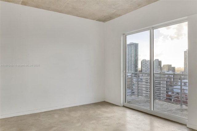 spare room featuring concrete floors