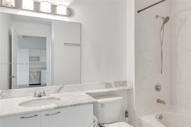 full bathroom with vanity, toilet, and tiled shower / bath combo