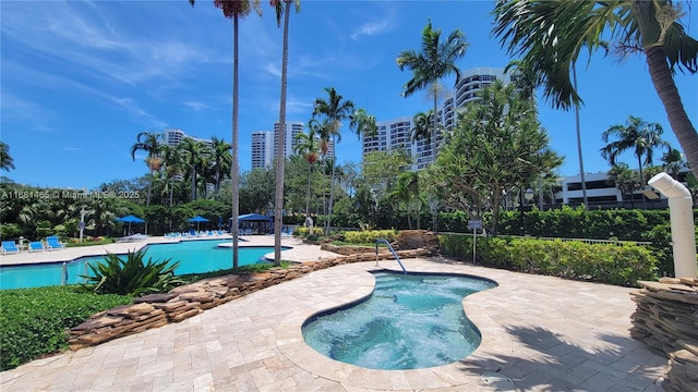 view of pool featuring a patio