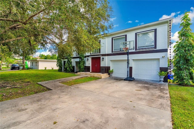 view of front of house featuring a front yard and a garage