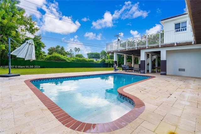 view of pool featuring a patio area and a lawn