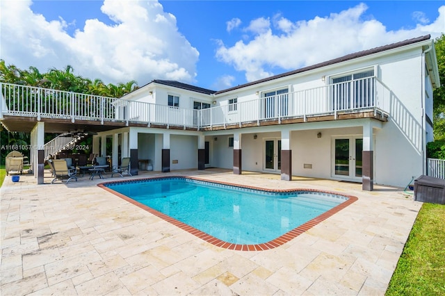 view of pool featuring a patio area and ceiling fan