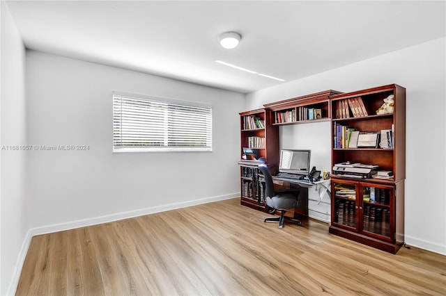 office space with light hardwood / wood-style flooring