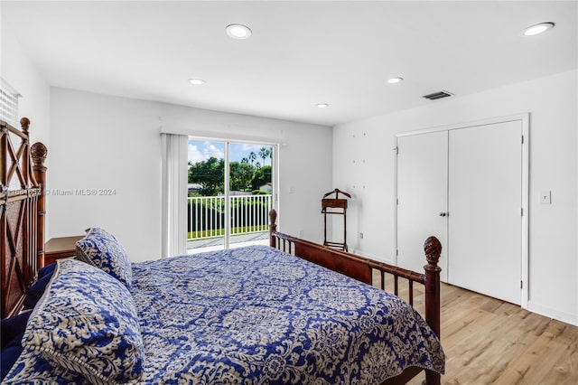 bedroom featuring a closet, access to outside, and light hardwood / wood-style flooring