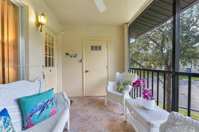 balcony with a patio area and ceiling fan