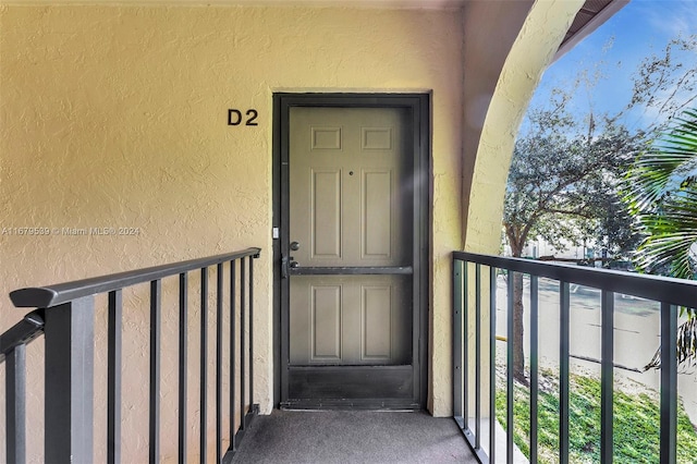 doorway to property featuring a balcony