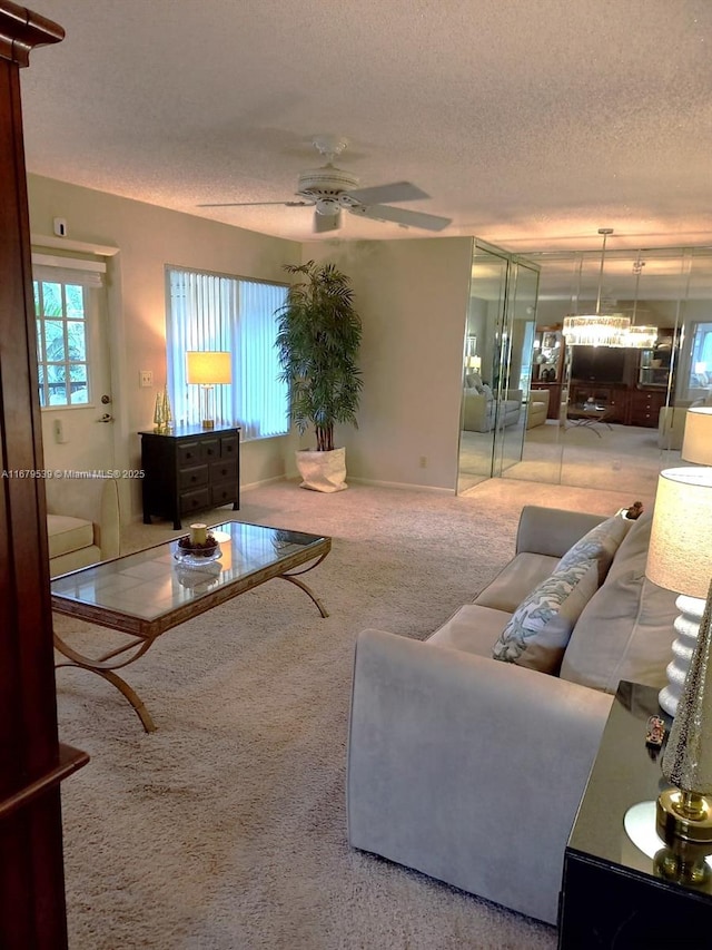442 Pine Glen Ln Unit D-2, Green Acres, FL 33463 - living room with a textured ceiling, carpet flooring, and a ceiling fan