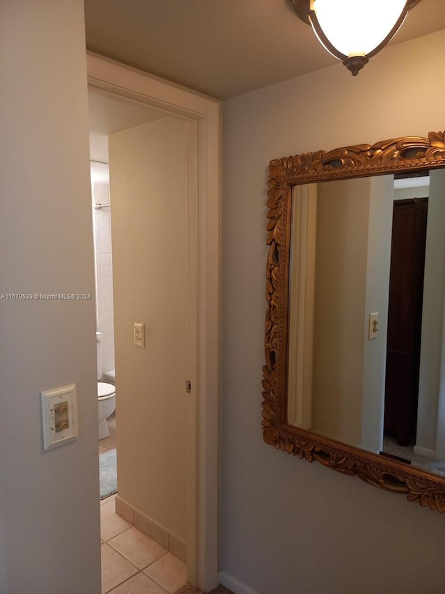 hallway featuring light tile patterned floors