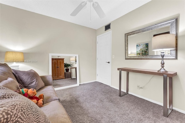 carpeted living room with ceiling fan